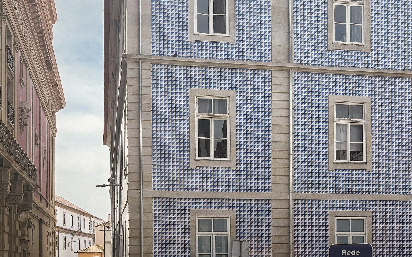 Close-up of blue-and-white azulejo tilework, geometric pattern, sharp detail